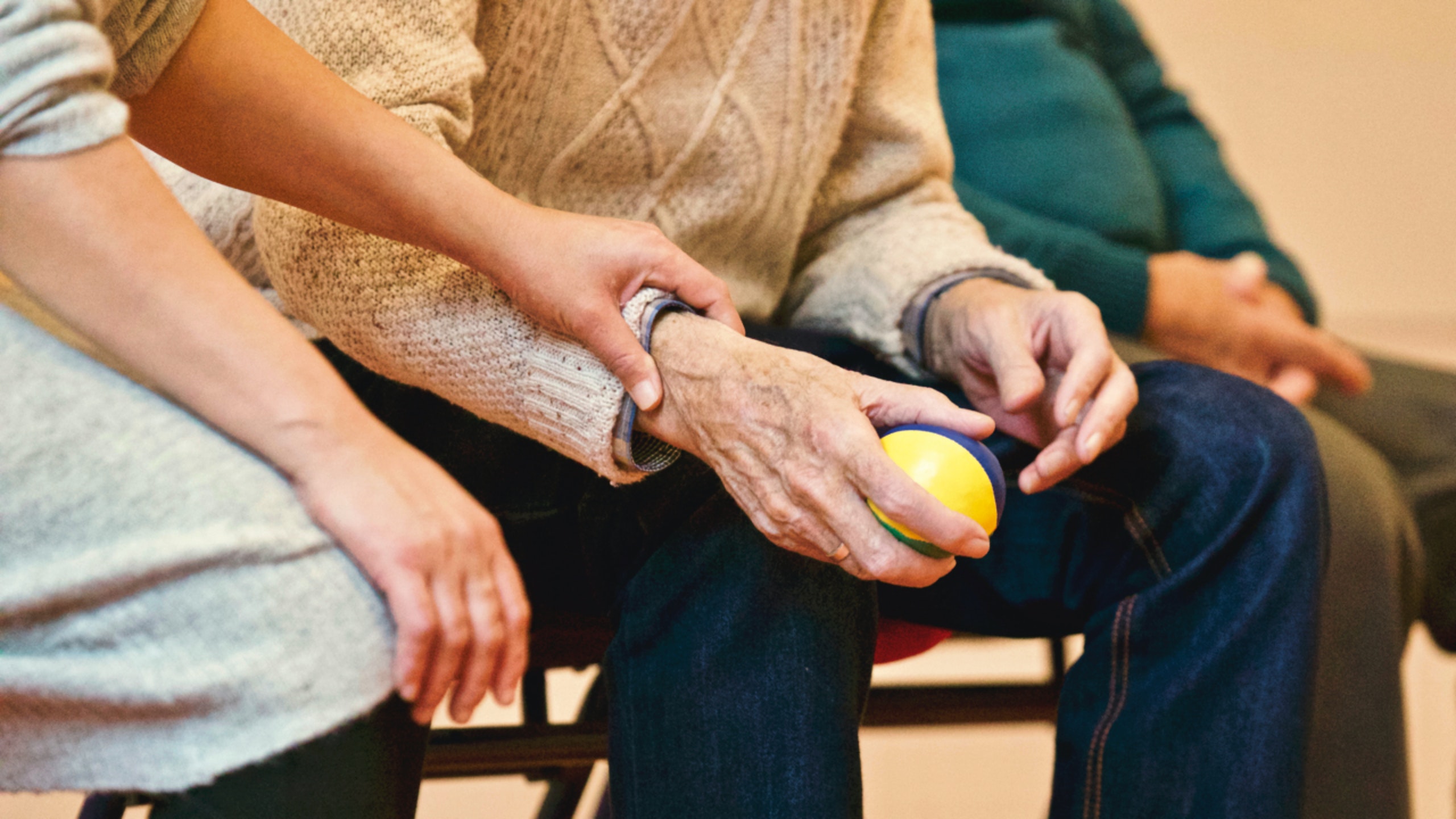 hand reaching out to elderly hand